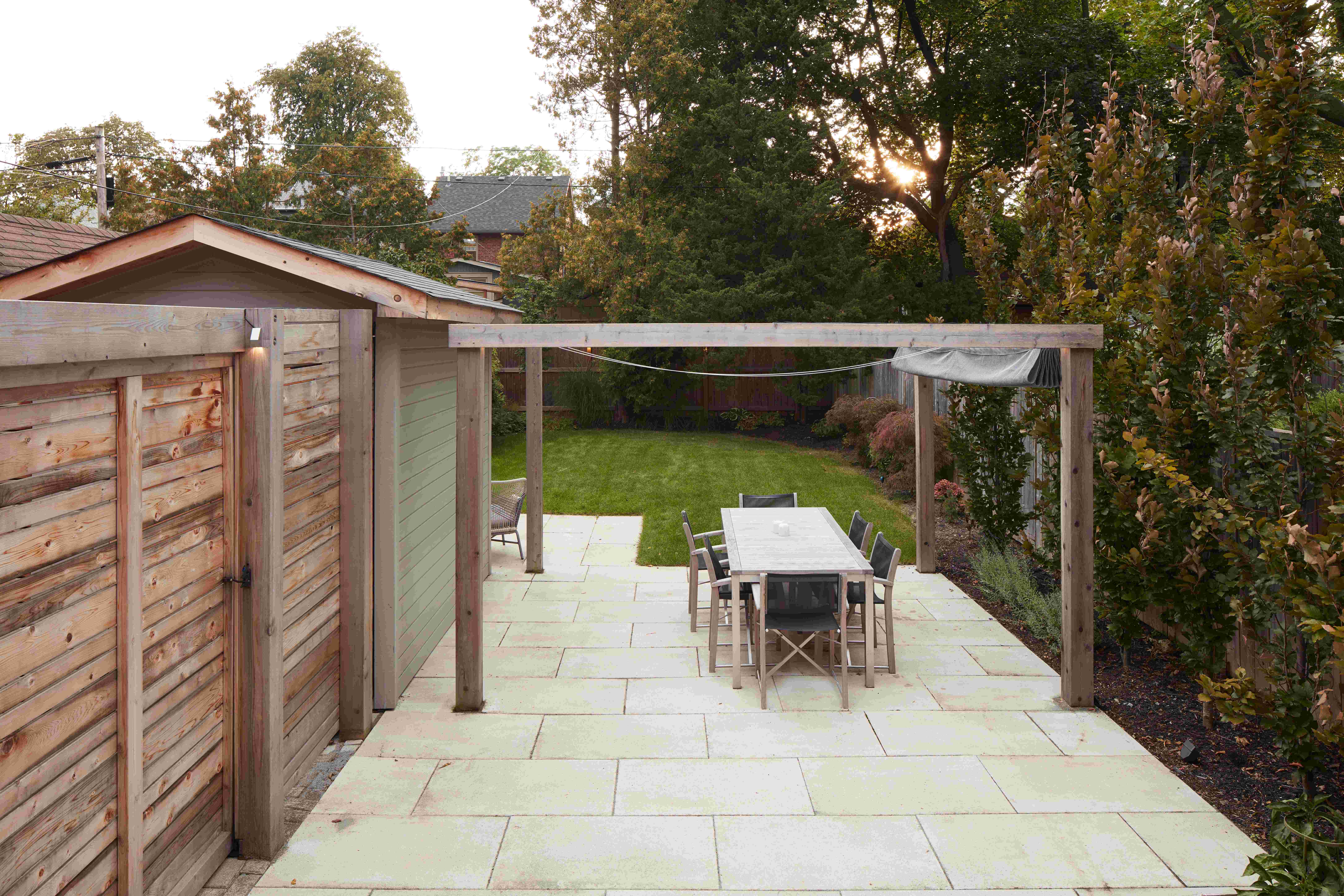 Back Fence, Stone Patio, Pegola + Seating area