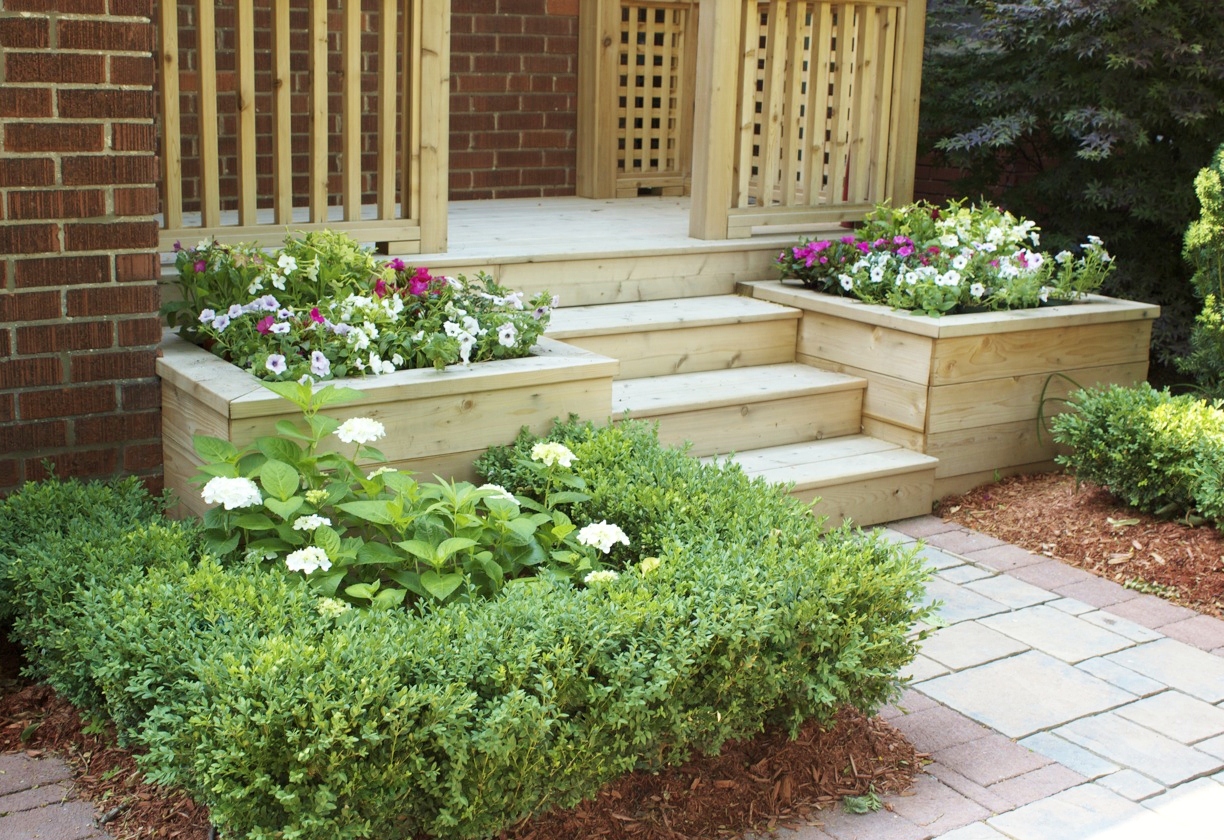 Custom built planters leading up to front porch