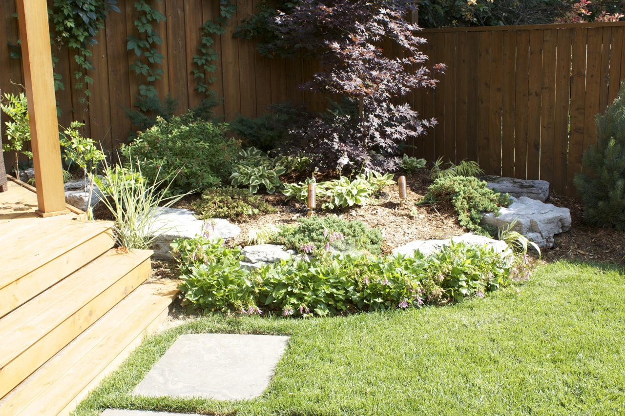 Garden Beds next to raised covered seating area