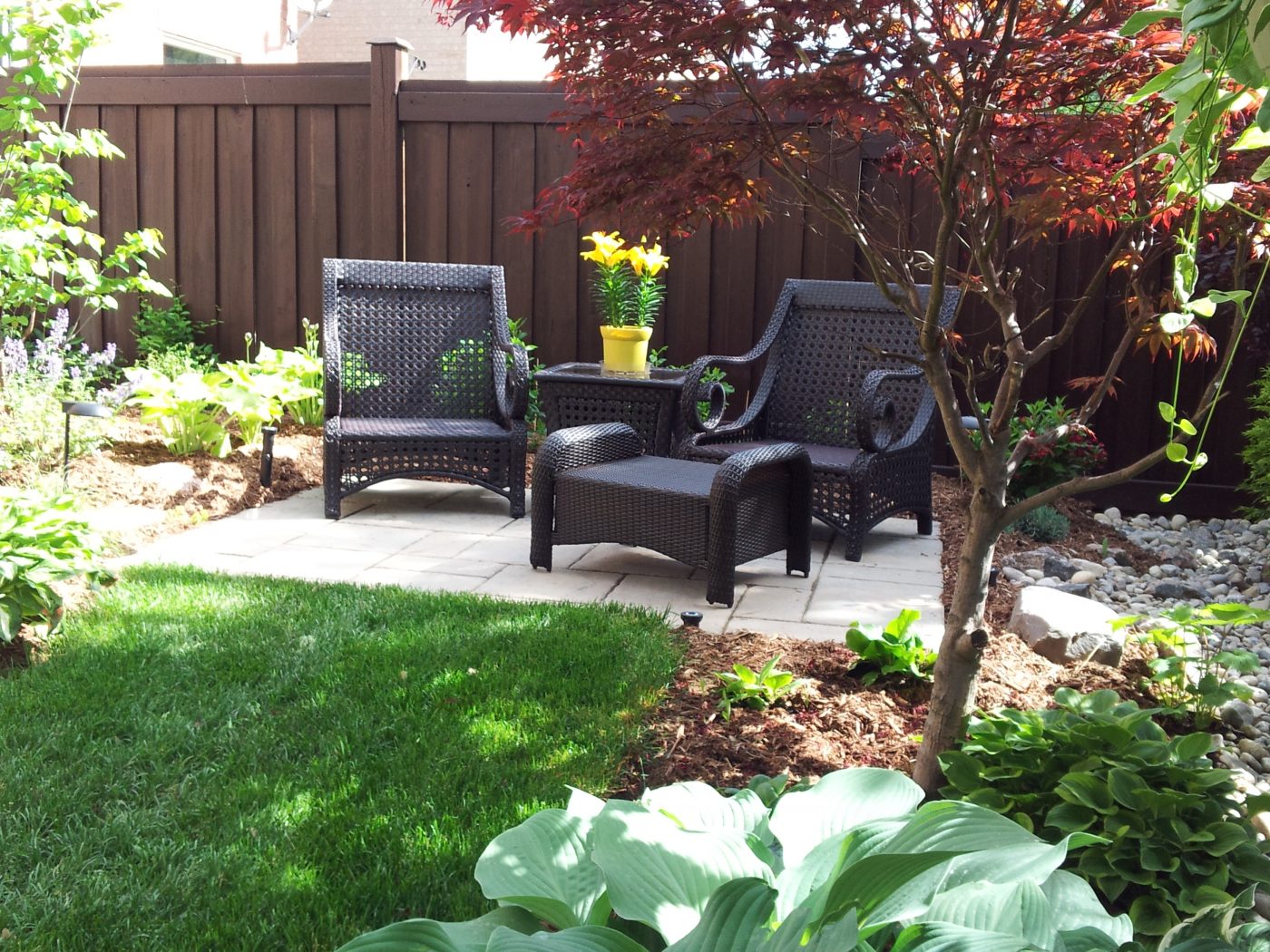 Out Door Seating area with freshly mulched gardens