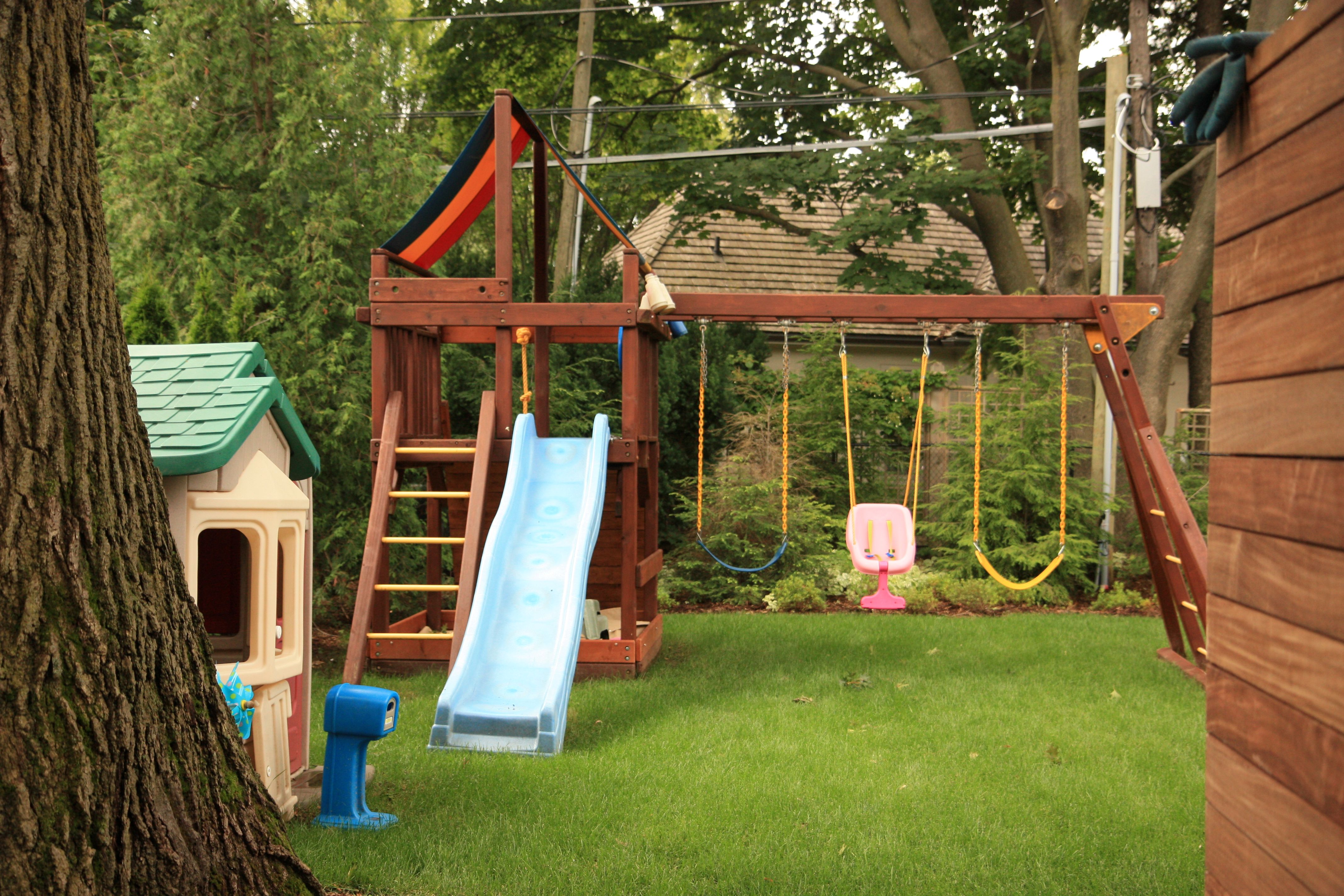 Backyard Place structure with fresh mowed lawn