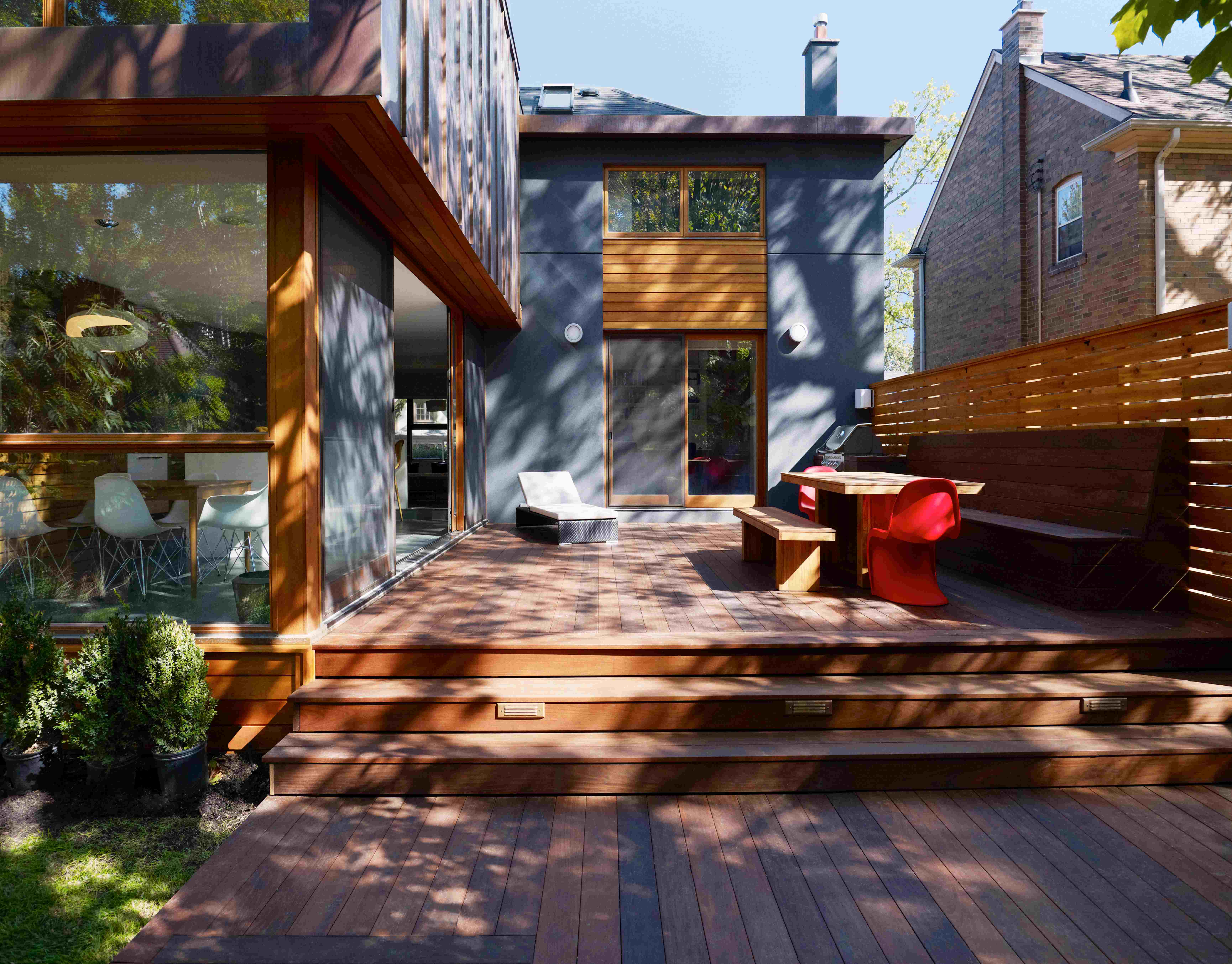 tree coverage provides this beautiful custom built deck maximum protection from the sun while giving just enough for plant growth
